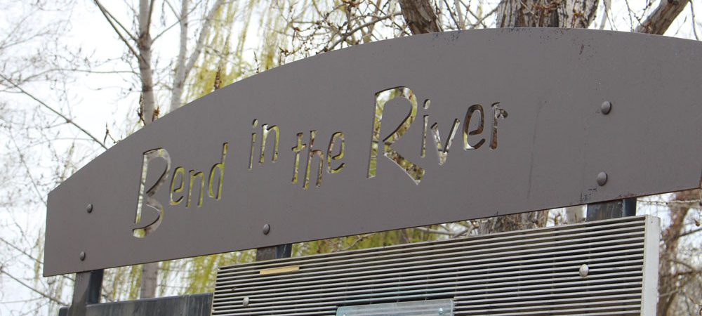 Sign saying Bend in the River