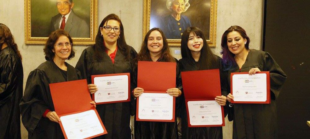 Graduates holding certificates